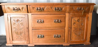 Lot 520 - An Art Nouveau style pine sideboard, with...