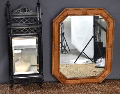 Lot 421 - An Arts and Crafts oak framed wall mirror with...