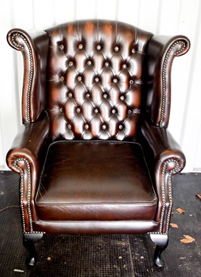 Lot 518 - A modern brown leather 'Chesterfield' type...