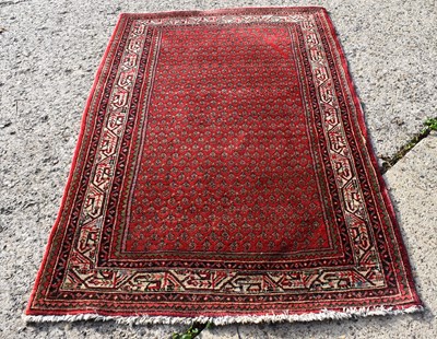 Lot 511 - A Persian Ghashgai rug, red ground with...