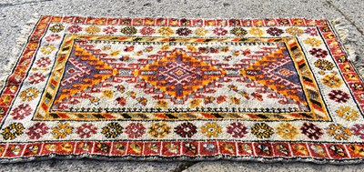 Lot 509 - A hand knotted long pile wool rug of Shirvan...