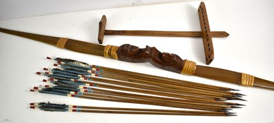 Lot 433 - A Native American decorative wooden bow and...