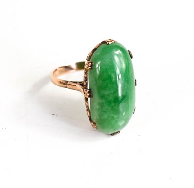 Lot 25A - A 9ct gold and jade ring, the oval cabochon...