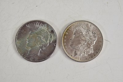 Lot 95 - An 1884 silver Morgan dollar together with a...