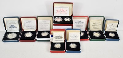 Lot 111 - A group of silver proof coins to include a...