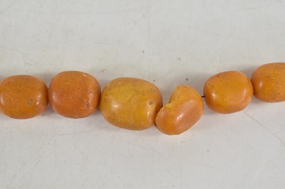 Lot 18 - A vintage butterscotch amber beaded necklace,...