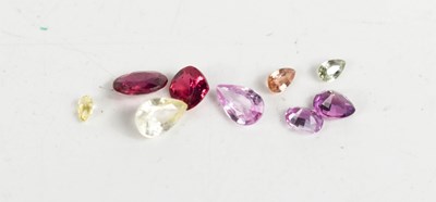 Lot 271 - A group of loose gemstones, to include pink...