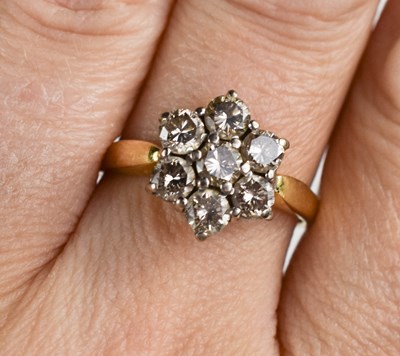 Lot 56 - An 18ct yellow gold and diamond flowerhead...