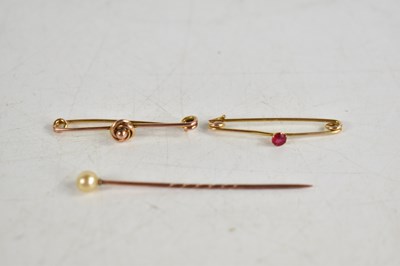 Lot 268 - Two 9ct gold pin brooches, one set with a pink...