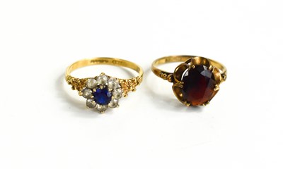 Lot 25 - Two 9ct gold rings, one set with an oval cut...