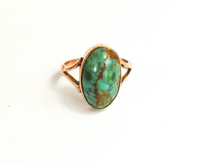 Lot 251 - A 9ct gold and turquoise ring, the oval...