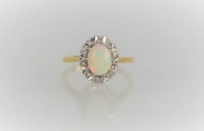 Lot 166 - A 9ct gold, opal and diamond ring, 3.8g, size M