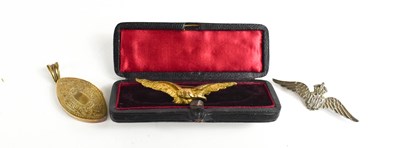 Lot 135 - An RAF silver brooch, a gilt metal brooch in...