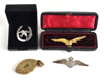 Lot 135 - An RAF silver brooch, a gilt metal brooch in...