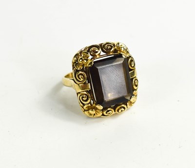 Lot 23 - A 9ct gold and smoky quartz ring, the...