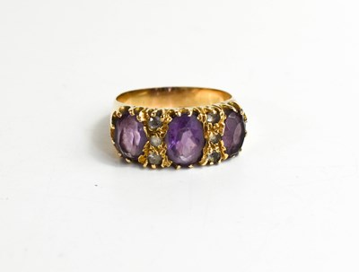 Lot 73 - A 9ct gold, amethyst and diamond ring, the...