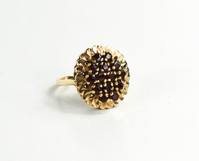 Lot 279 - A 9ct gold and garnet cluster ring, set in...