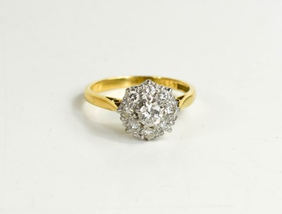 Lot 306 - An 18ct gold, diamond and cluster ring, the...