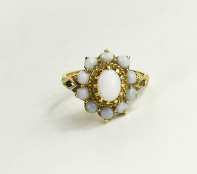 Lot 62 - A 9ct gold and opal flowerhead ring, the oval...