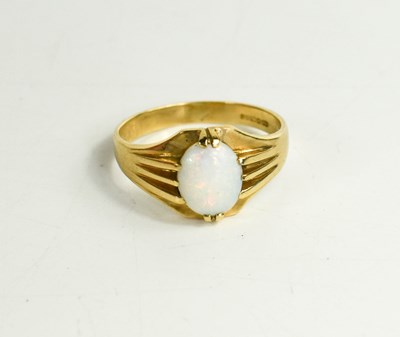 Lot 286 - A 9ct gold and opal ring, circa 1970, the oval...