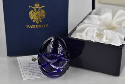 Lot 313 - A Faberge cut glass 'Crystal' egg, the blue...