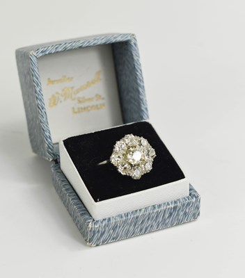 Lot 4 - An 18ct white gold and diamond flowerhead ring,...