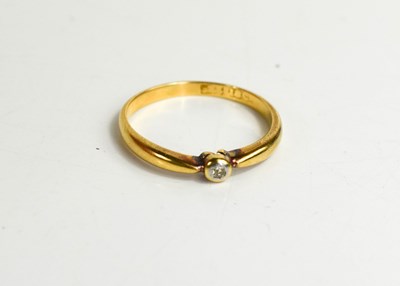 Lot 69 - An 18ct gold and diamond solitaire ring, size...