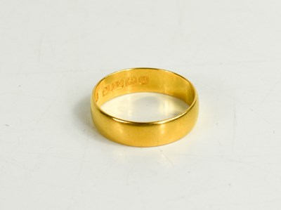 Lot 235 - A 22ct gold wedding band, size L, 3.09g.