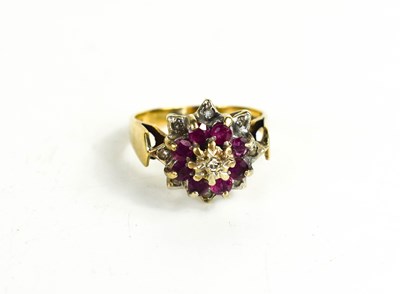 Lot 34 - A 9ct gold, diamond and pink sapphire cluster...