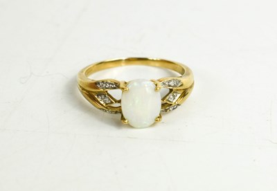 Lot 81 - A 9ct gold, opal and diamond ring, the oval...