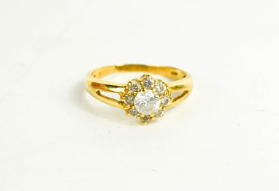 Lot 252 - An 18ct gold and cubic zirconia ring, of...