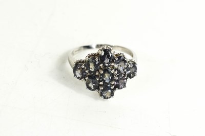 Lot 118 - A 9ct white gold and sapphire cluster ring,...