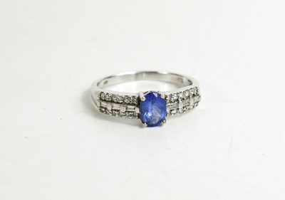 Lot 315 - An 18ct gold, tanzanite and diamond ring, the...