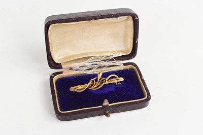 Lot 225 - A 19th century 15ct gold bar brooch, with...