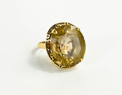 Lot 153 - An 18ct gold and pale citrine ring, the oval...