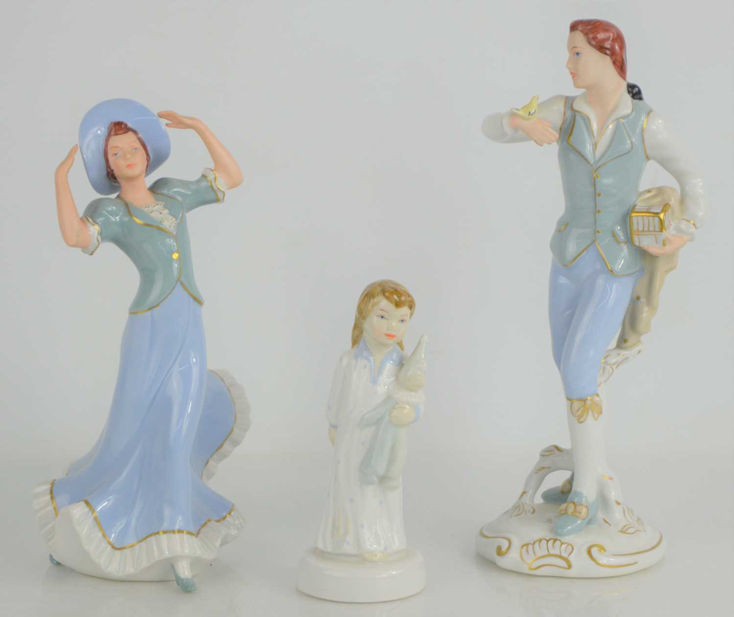 Lot 223 - Three Royal Dux figurines to include elegant...