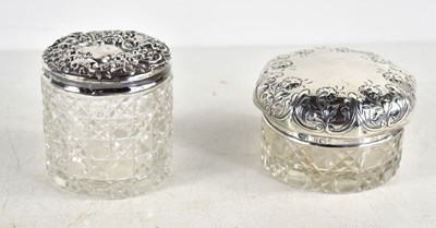 Lot 354 - Two dressing table cut glass jars with silver...