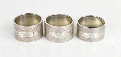 Lot 361 - A group of three matching silver napkin rings...