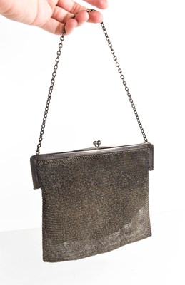 Lot 49 - A silver chainmail evening bag, with leather...