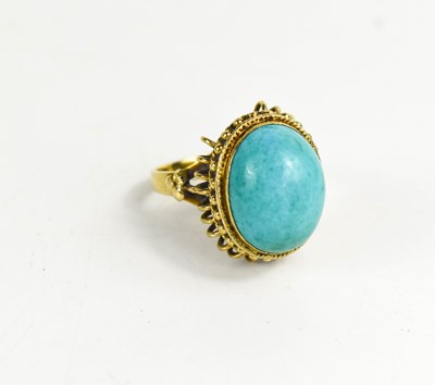 Lot 24 - A 14ct gold and turquoise cabochon ring, with...