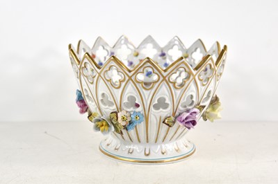 Lot 211 - A floral encrusted porcelain bowl in the...