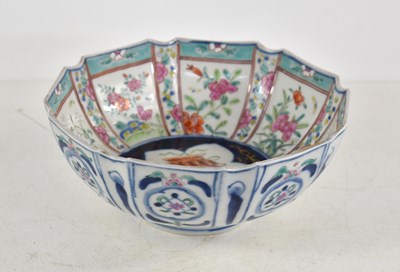 Lot 191 - An Oriental bowl decorated with panels of...