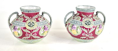 Lot 210 - A pair of Nippon twin handled vases of bulbous...