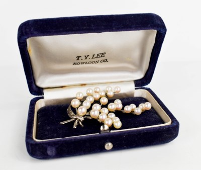 Lot 207 - A sterling silver and pearl brooch, in the...