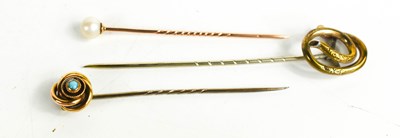 Lot 335 - Three antique tie pins, a gold (unmarked,...