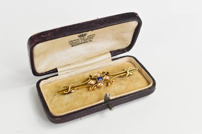 Lot 114 - A 15ct gold, sapphire and seed pearl bar...