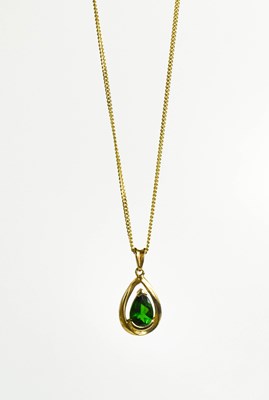 Lot 138 - A 9ct gold and green topaz set pendant...