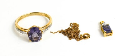 Lot 263 - A 9ct gold, amethyst and diamond ring, the...