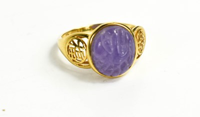 Lot 269 - A 14ct gold Chinese lilac jade ring, the oval...