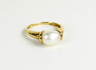 Lot 289 - A 9ct gold and single pearl ring, size R, 2.9g.